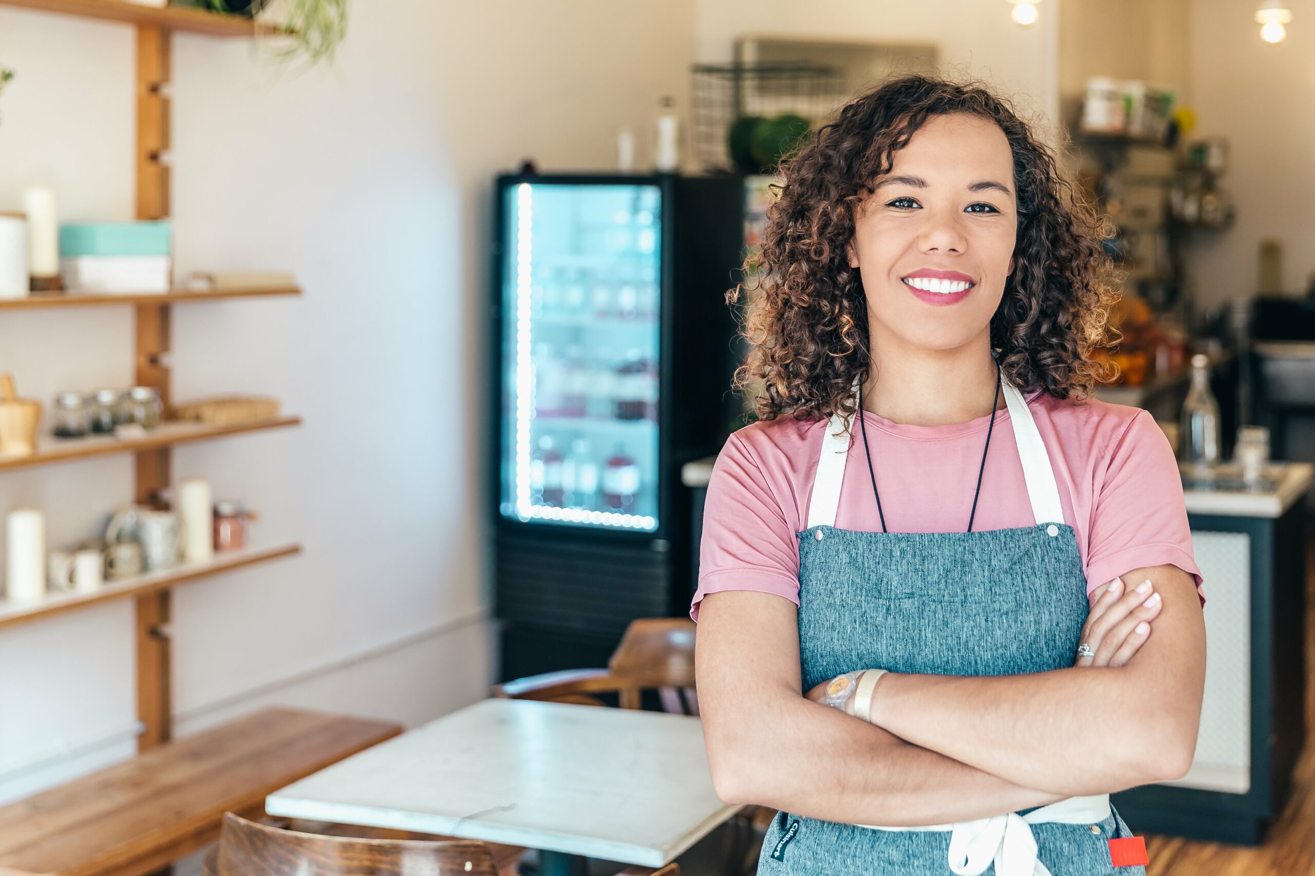 Canadian entrepreneur in a cafe smiling