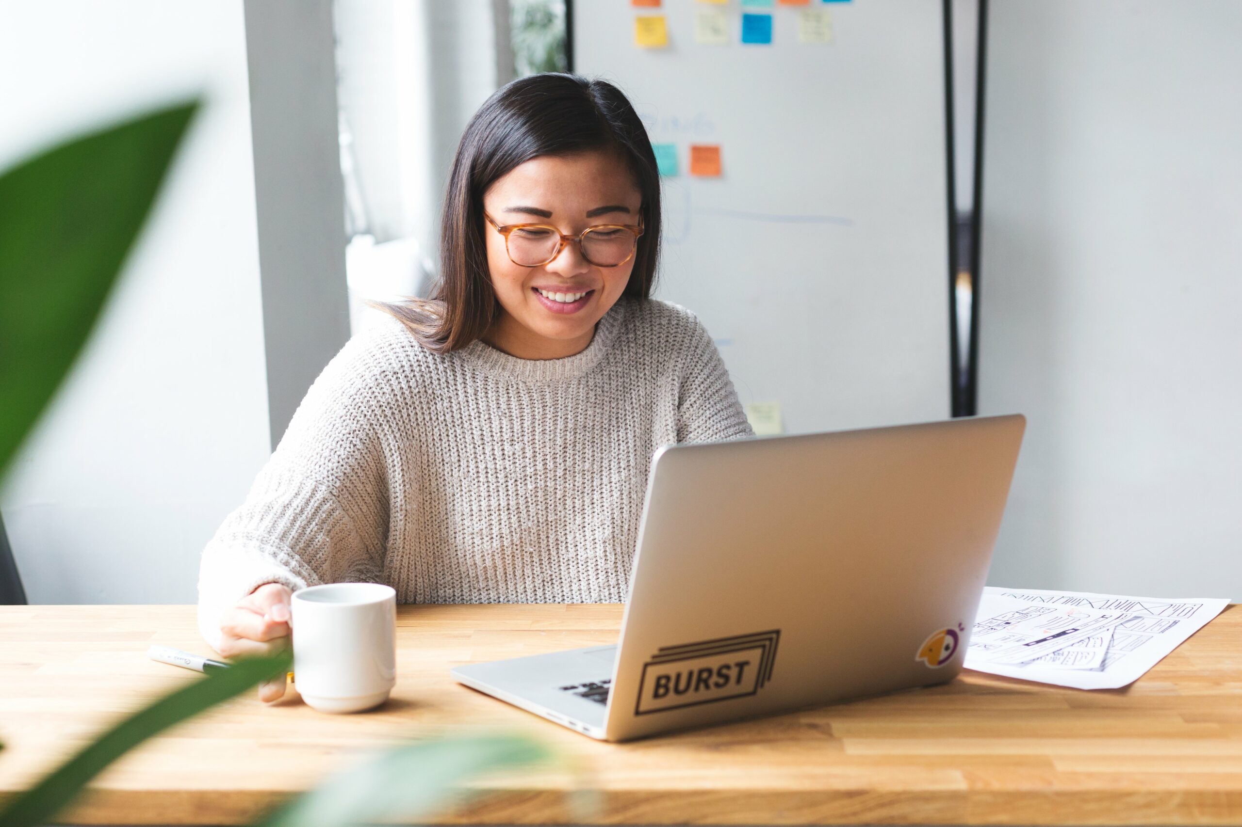 Entrepreneur in Canada sitting at a desk with a laptop