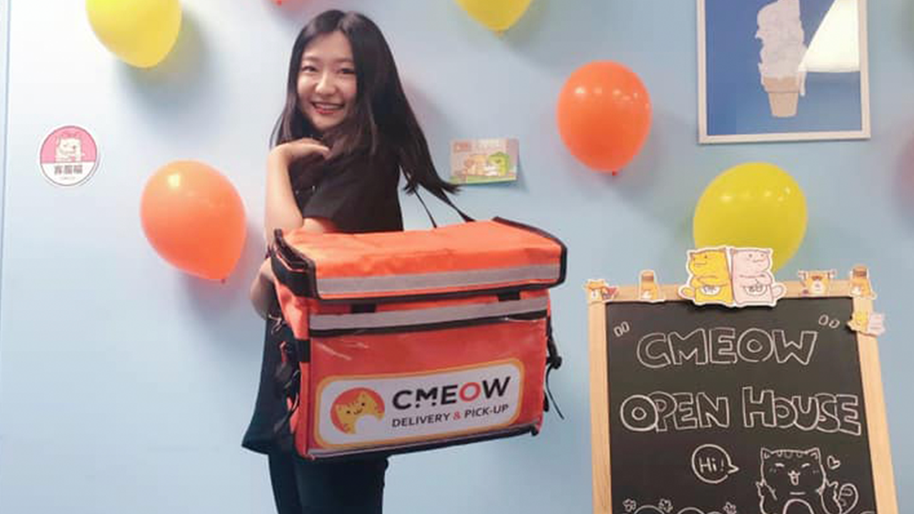 Ivy Chen wearing a CMEOW delivery bag along with company-related items